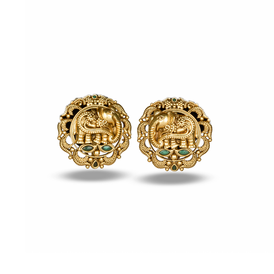 Pair of gold earrings with elephant design on a white background