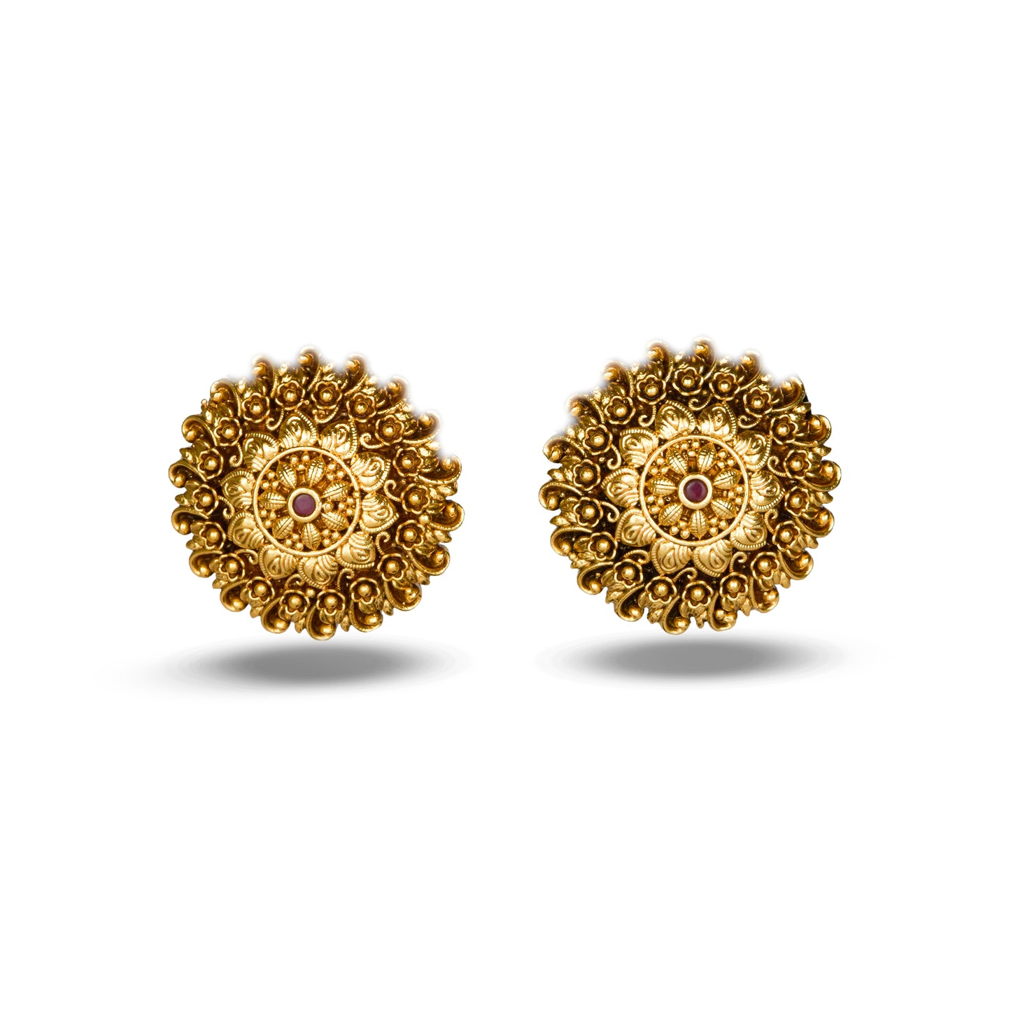 Pair of gold earrings with intricate designs on a white background