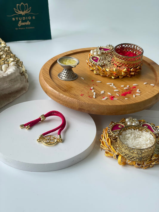 Gold Plated Rope Closure Swastik Bracelet