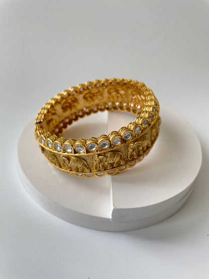 Gold Finish Elephant Carvings Bangle with Kundan Accents