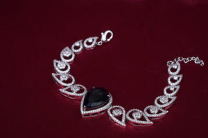 Zircon Bracelet with Red Pear Center Stone