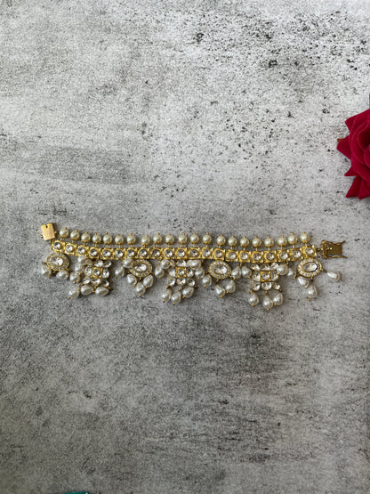 Gold Finish Tasseled Pearl with Kundan Bracelet