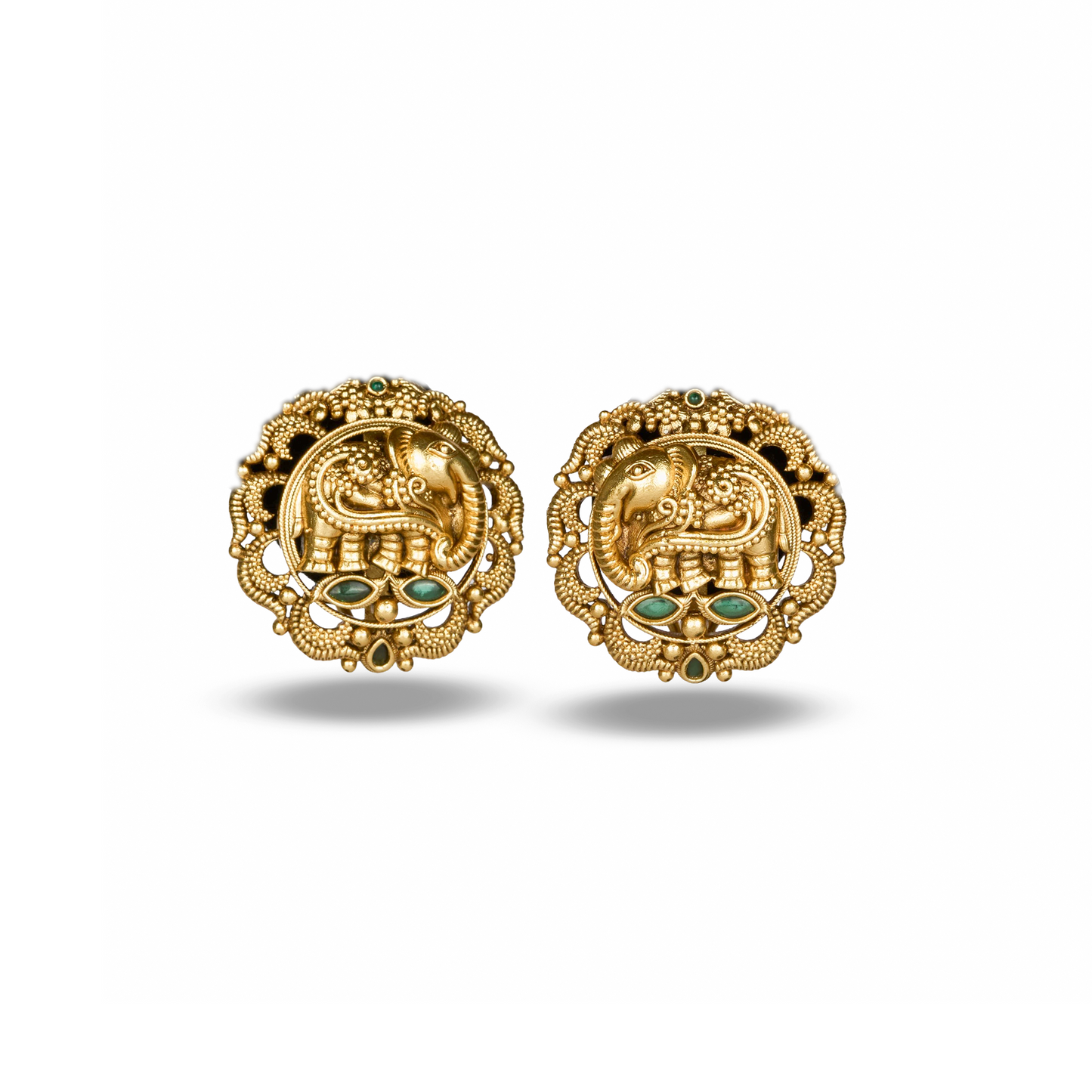 Pair of gold earrings with elephant design on a white background