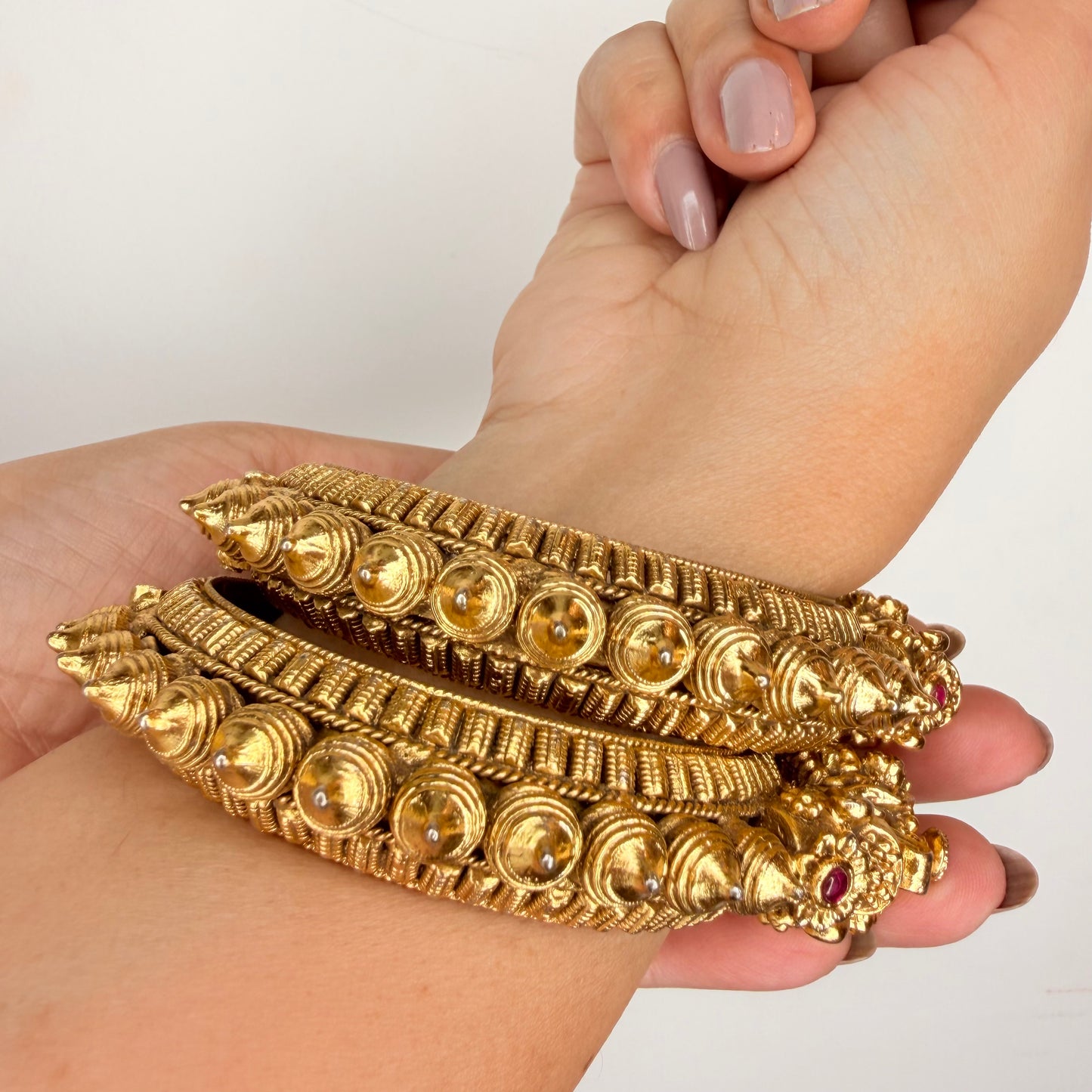 Gold Finish Temple Motif Bangle Set