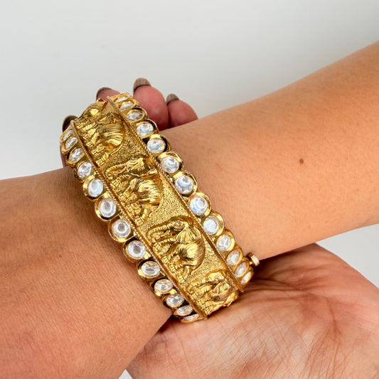 Gold Finish Elephant Carvings Bangle with Kundan Accents
