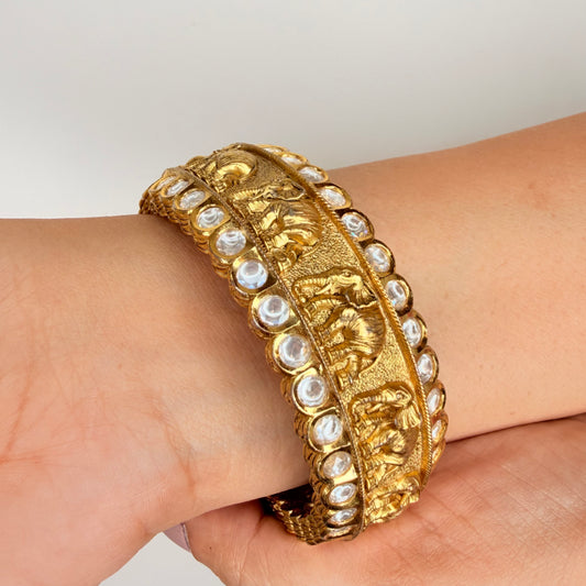 Gold Finish Elephant Carvings Bangle with Kundan Accents