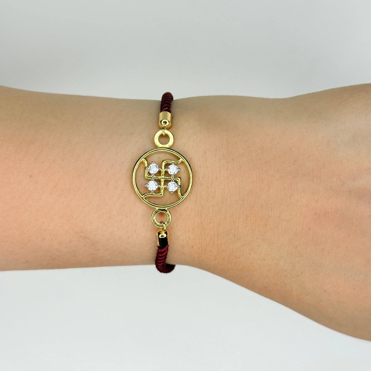 Gold Plated Rope Closure Swastik Bracelet