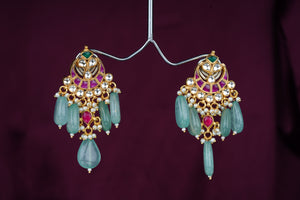 Traditional kundan earrings with hanging green beads