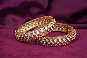Traditional openable bangles in gold polish, base metal 70% silver.